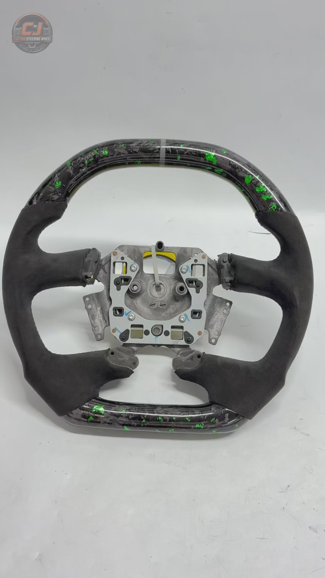 White background product video of Ford Falcon FG XR XR6 XR8 custom steering wheel in green flake forged carbon and black Alcantara by CJ Mod Garage