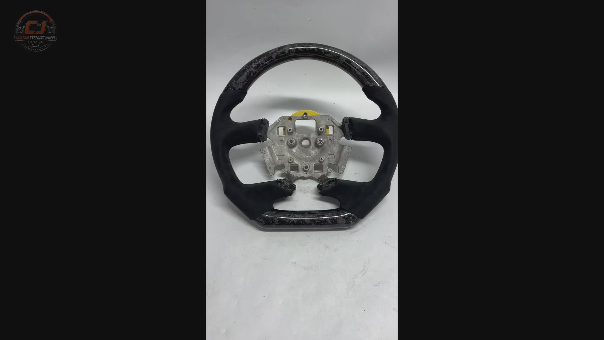 Ford Falcon FG XR XR6 XR8 custom steering wheel white background product video featuring forged carbon fiber and black Alcantara by CJ Mod Garage