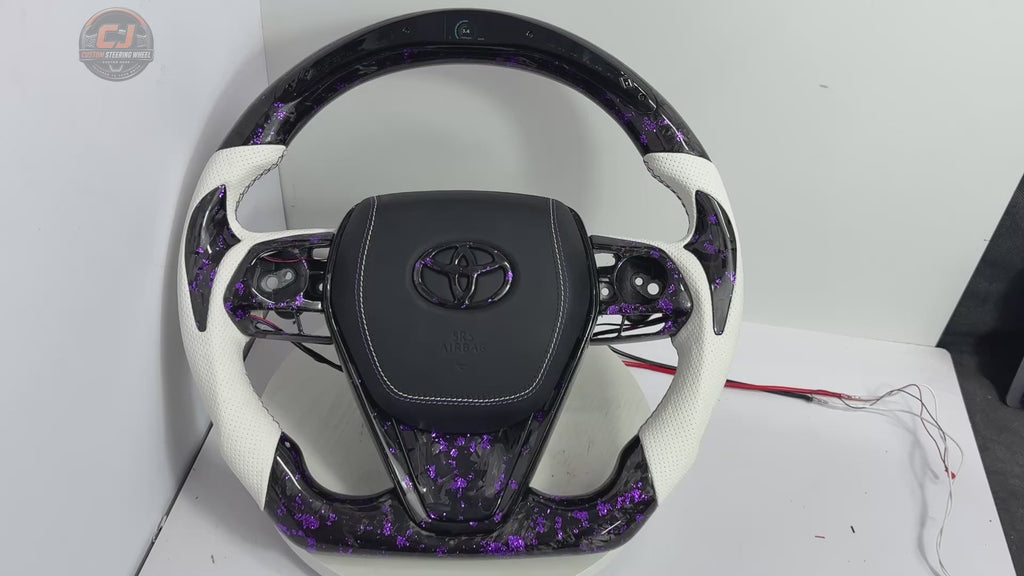 Studio showcase video of Toyota Camry forged carbon fiber steering wheel with purple flake accents, white perforated leather grips, custom stitching and LED shift light system by CJ Mod Garage