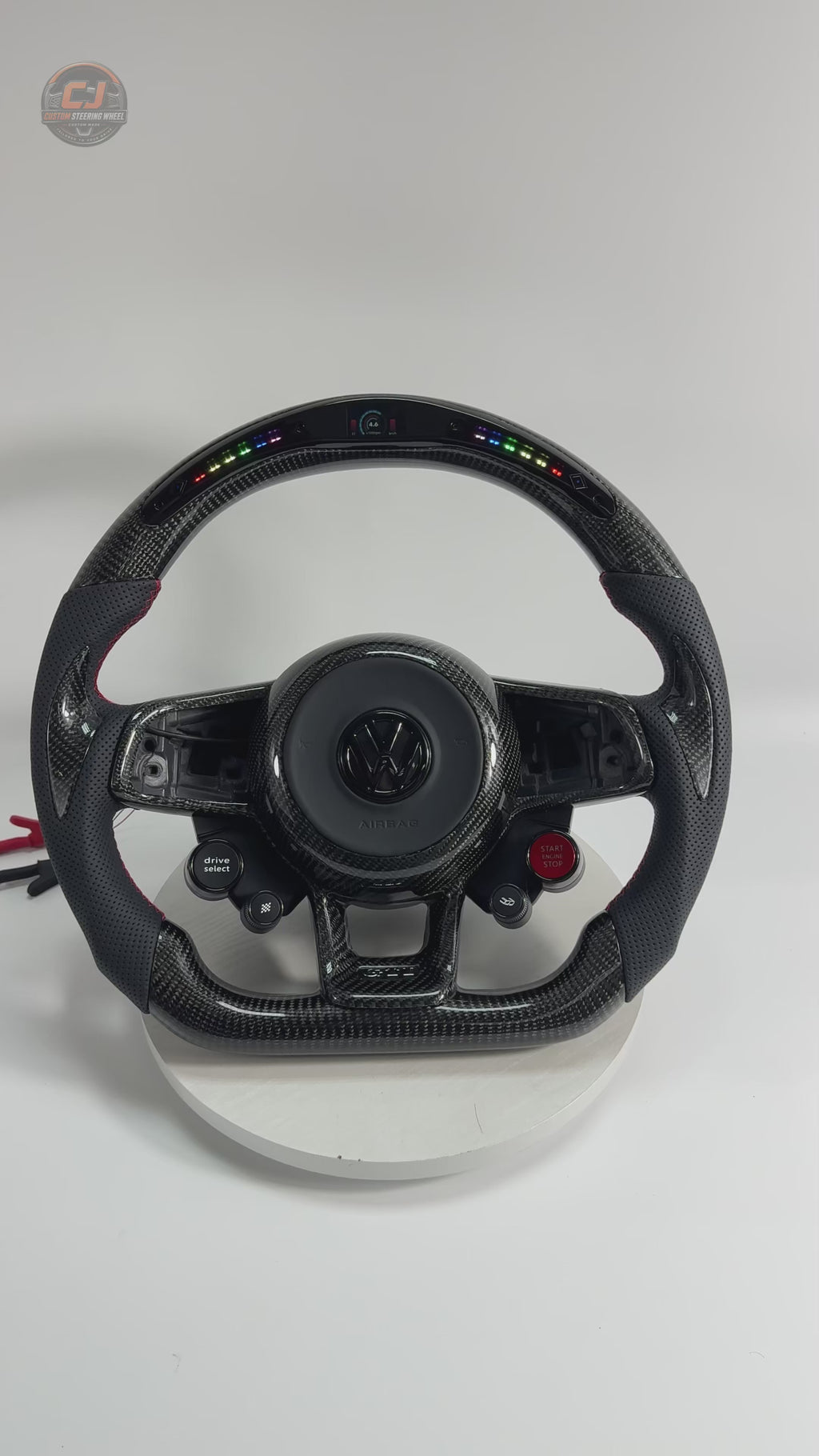 Product showcase video featuring LED shift light display carbon fiber steering wheel with perforated leather grips for MK7 GTI Golf 6 7 7.5 R R Line CC Polo Passat B8 by CJ Mod Garage