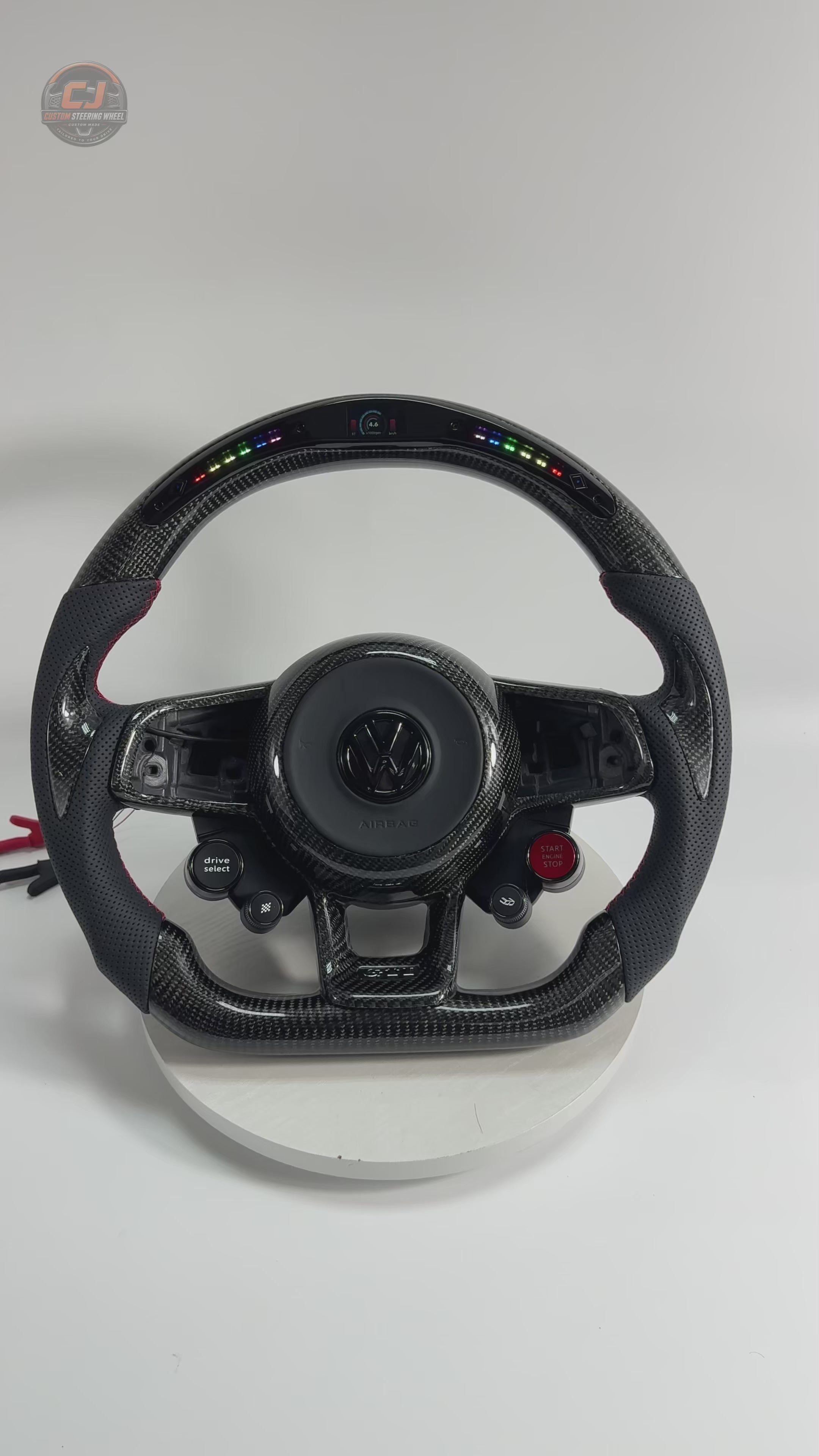 Product showcase video featuring LED shift light display carbon fiber steering wheel with perforated leather grips for MK7 GTI Golf 6 7 7.5 R R Line CC Polo Passat B8 by CJ Mod Garage